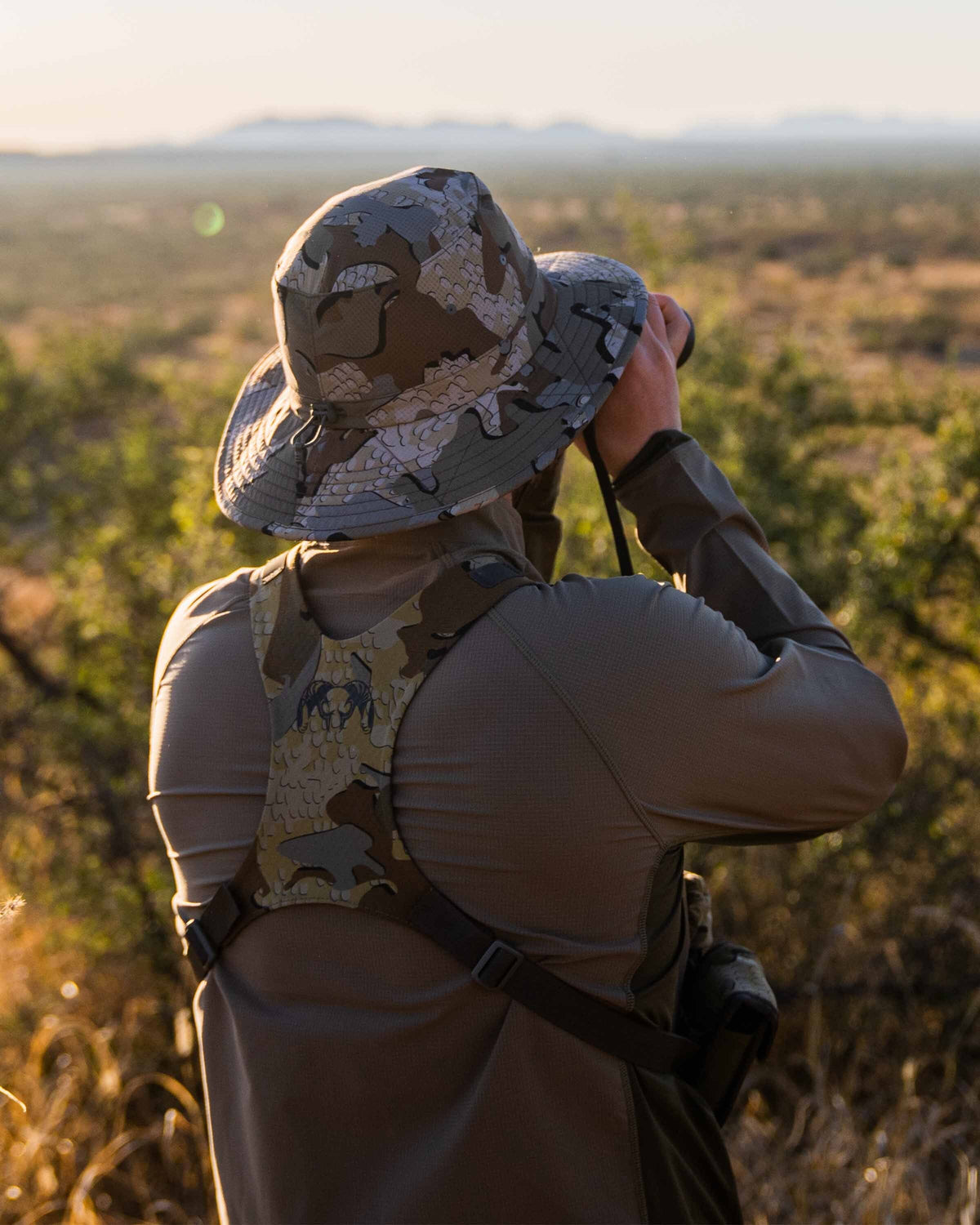 Back of hunter wearing Gila PRO Airmesh Boonie Hat in Valo Camouflage glassing