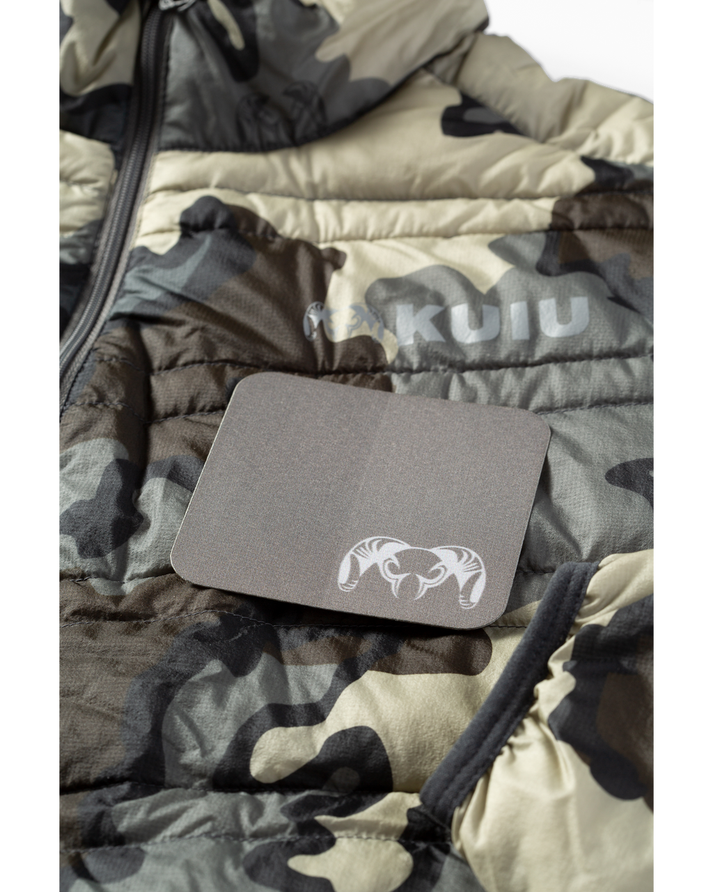 KUIU Noso Patch in Gunmetal Grey sitting on top of down jacket in Vias Camouflage