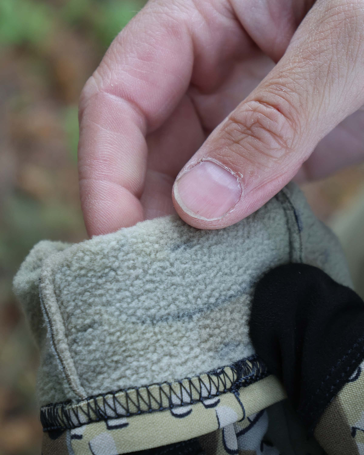 Showcasing cuff rolled back, Highlighting interior knit-fleece on the StrongFleece 290 Glove in Valo Camouflage