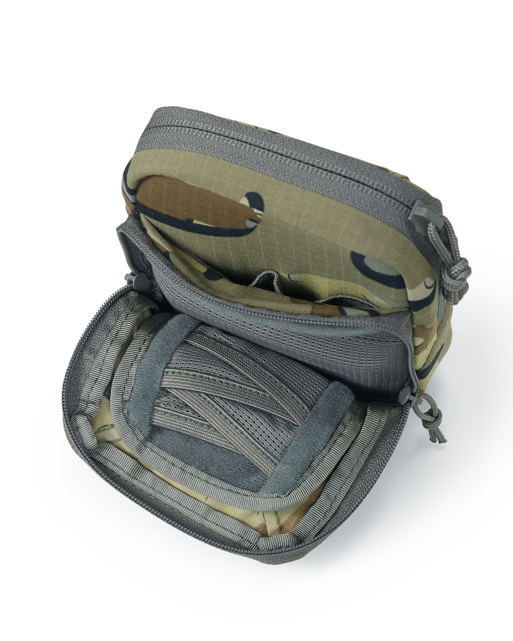 Unzipped front pouch of the Slate Call Holder in Valo Camouflage, Featuring internal mesh divide pockets for storage