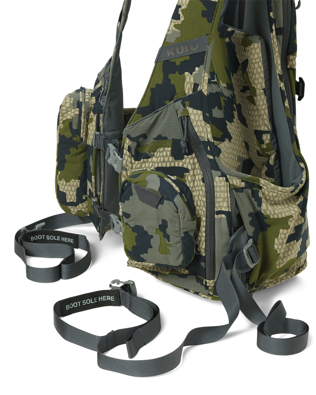 Close angled view of the Rival Turkey Vest in Verde Camouflage, Highlighting two zip-out webbing belts with boot stirrups