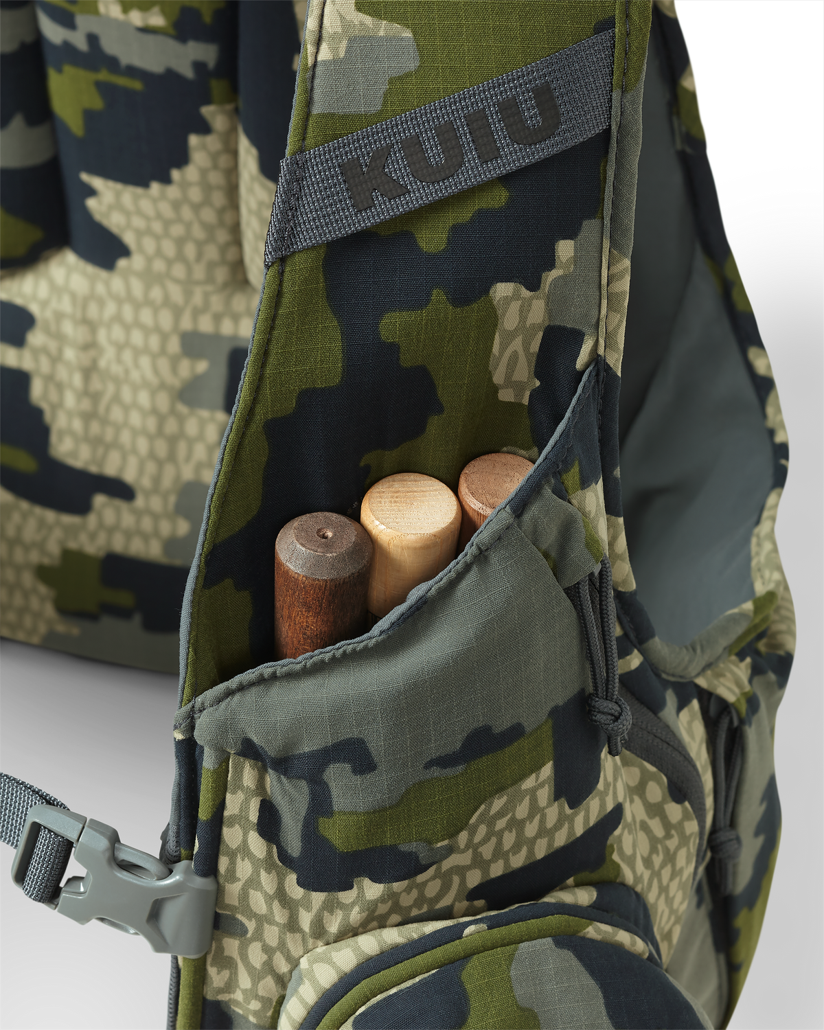 Close-up of front drop pocket on the Rival Turkey Vest in Verde Camouflage, featuring three strikers inside