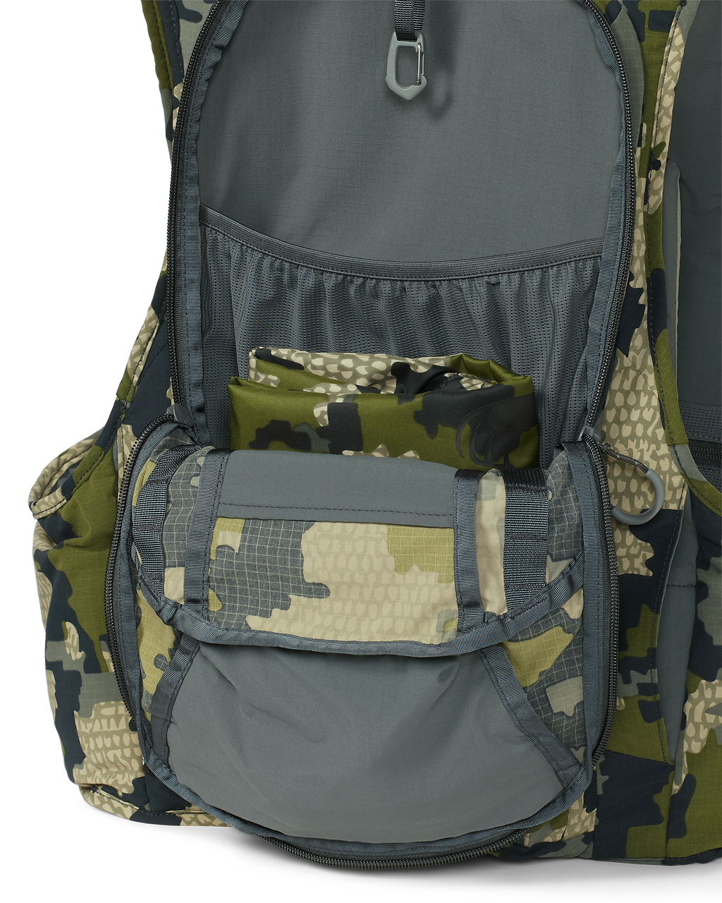 Back of Rival Turkey Vest in Verde Camouflage, Highlighting unzipped main pocket with visibility of internal storage pocket and stowed turkey carry bag