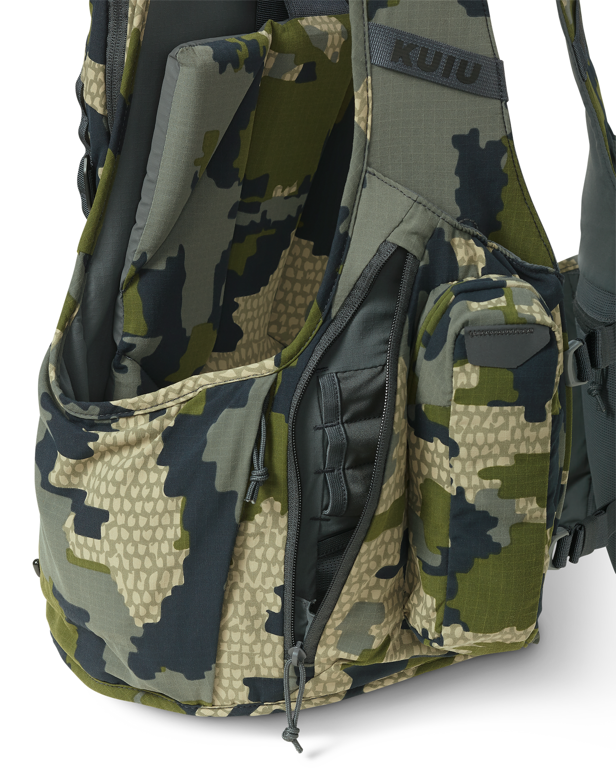 Close-up of the Rival Turkey Vest in Verde Camouflage, Highlighting the right side zippered pocket with internal shell holder and mesh storage pocket