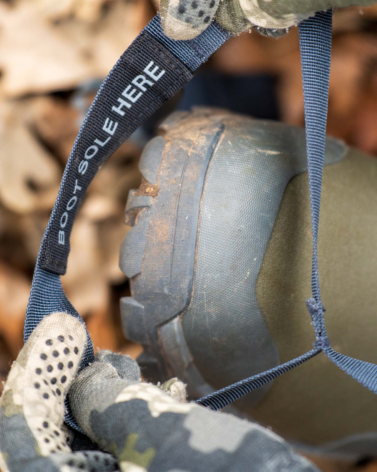 Hunter placing boot in the stirrup of the LeanLock active back support system on the KUIU Rival Turkey Hunting Vest