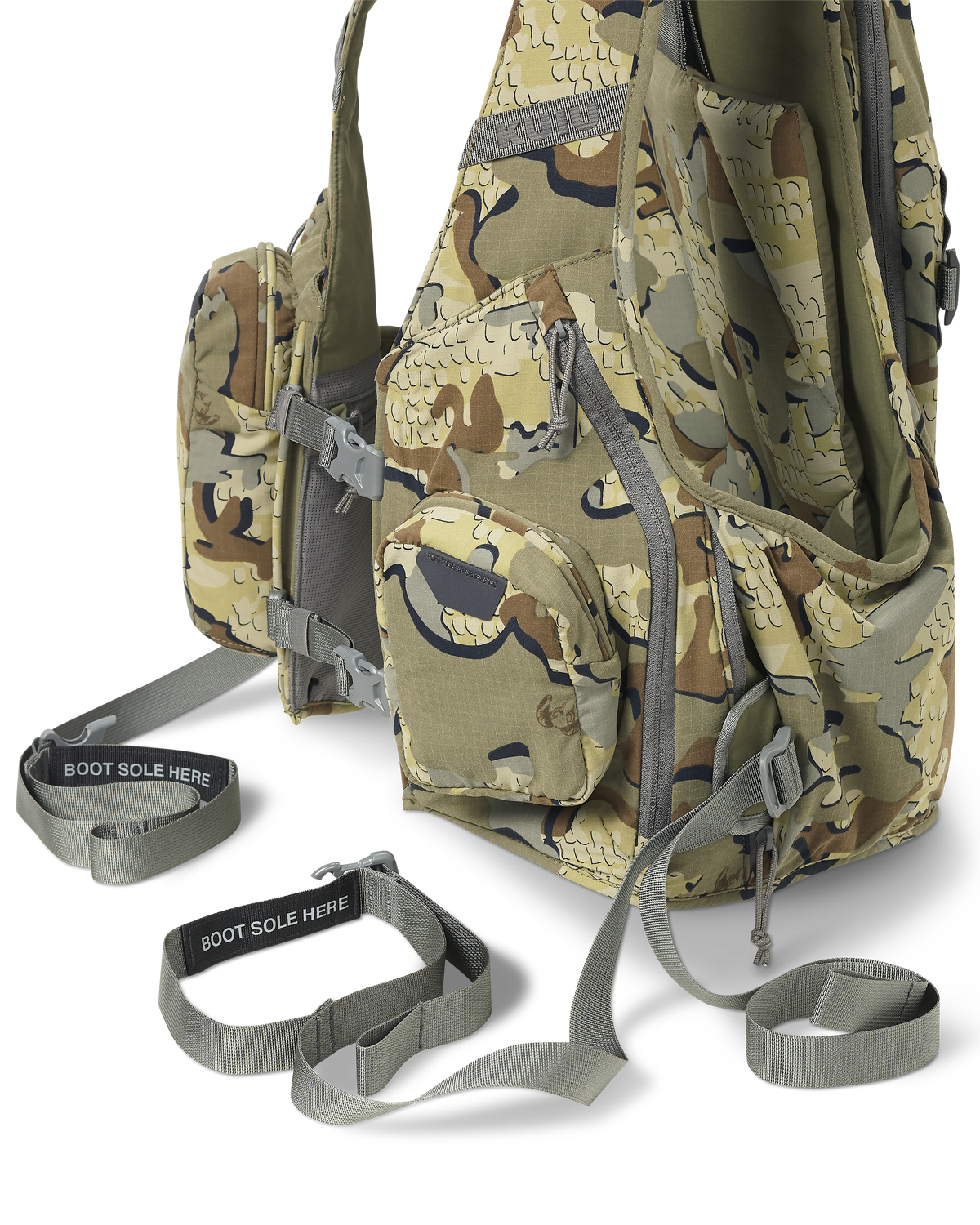 Close angled view of the Rival Turkey Vest in Valo Camouflage, Highlighting two zip-out webbing belts with boot stirrups