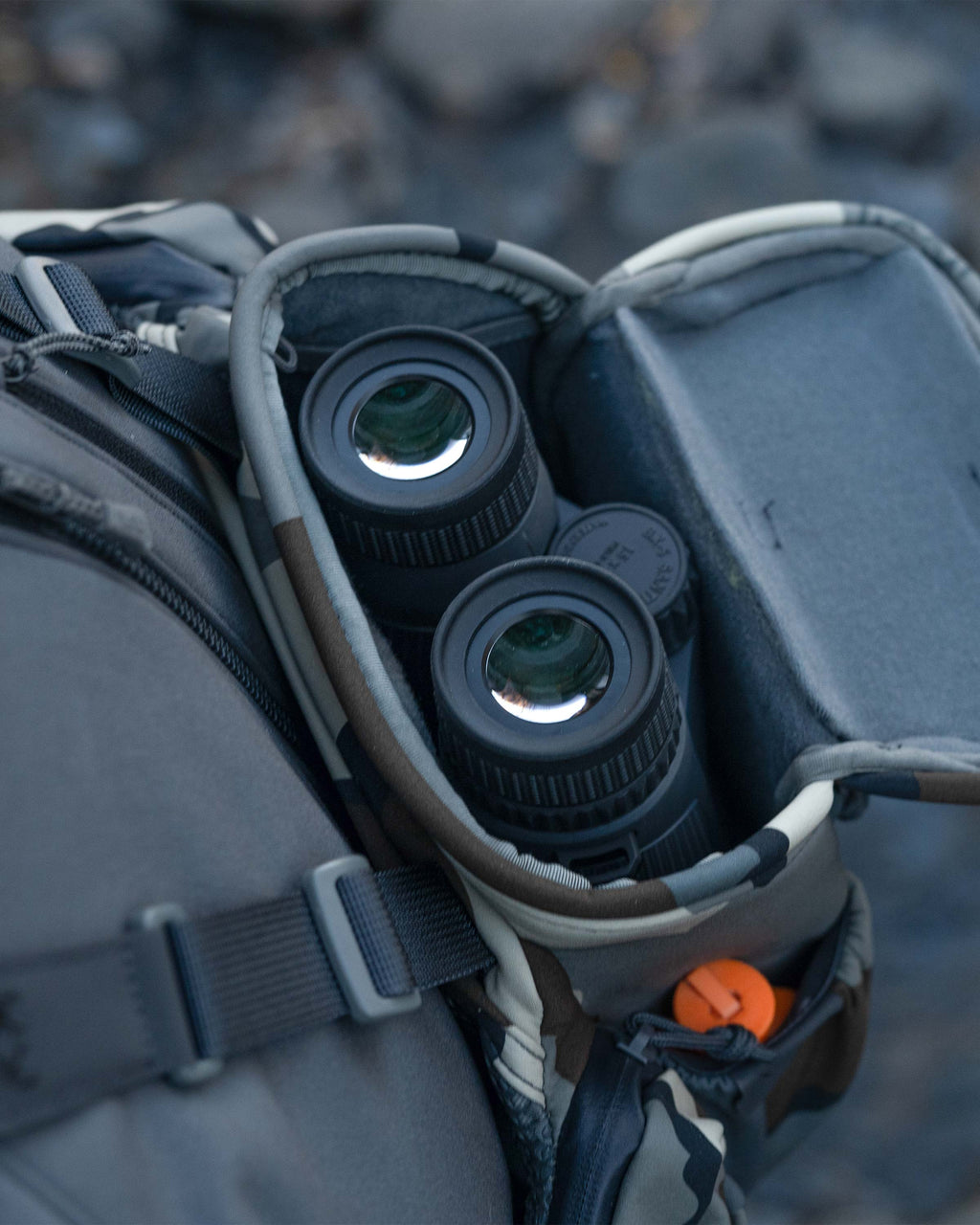 Close-up of inside main compartment with binocular nestled inside the PRO Chest Pack in Vias Camouflage