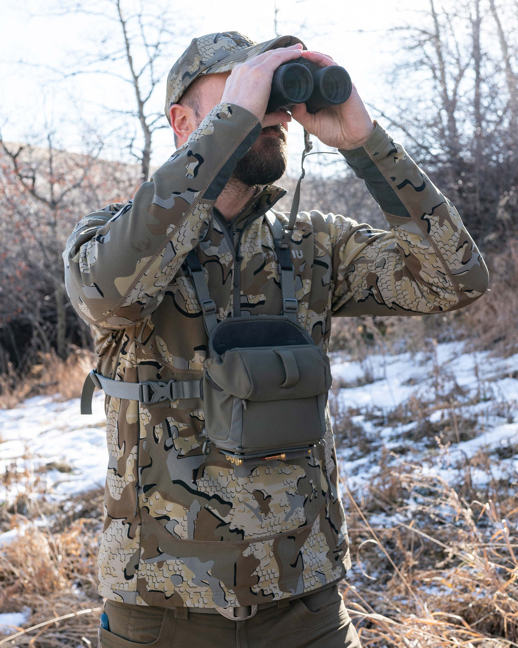 Hunter glassing and wearing PRO G3 Bino Harness in Ash Brown