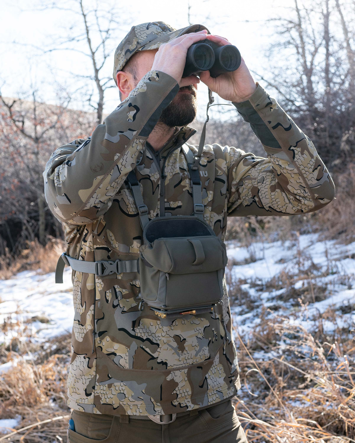 Hunter glassing and wearing PRO G3 Bino Harness in Ash Brown