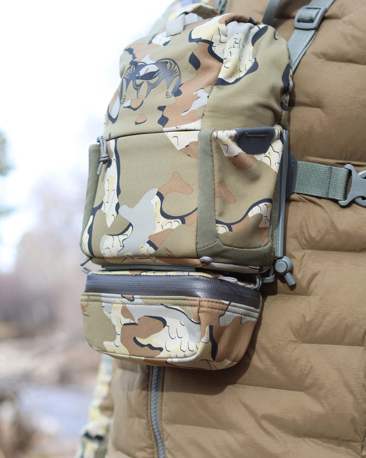 Angled view of PRO G3 Bino Harness Accessory Pocket attached to the bottom of the PRO G3 Bino Harness utilizing rail-lock connection system