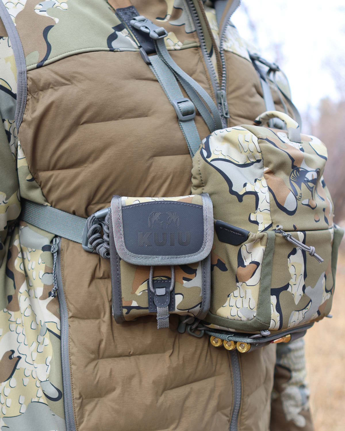 Side view of Hunter wearing PRO G3 Bino Harness in Valo Camouflage with the PRO G3 Rangerfinder Holder attached to the right side of the harness