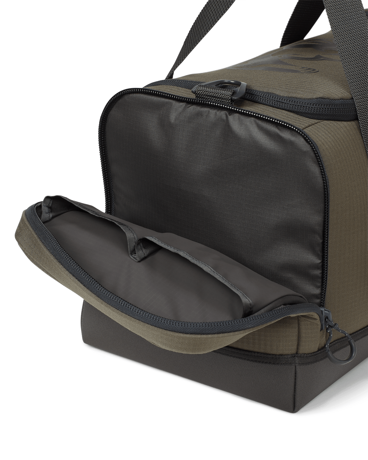 Distance Duffel with left side pocket zipped open showing two additional organization areas Ash