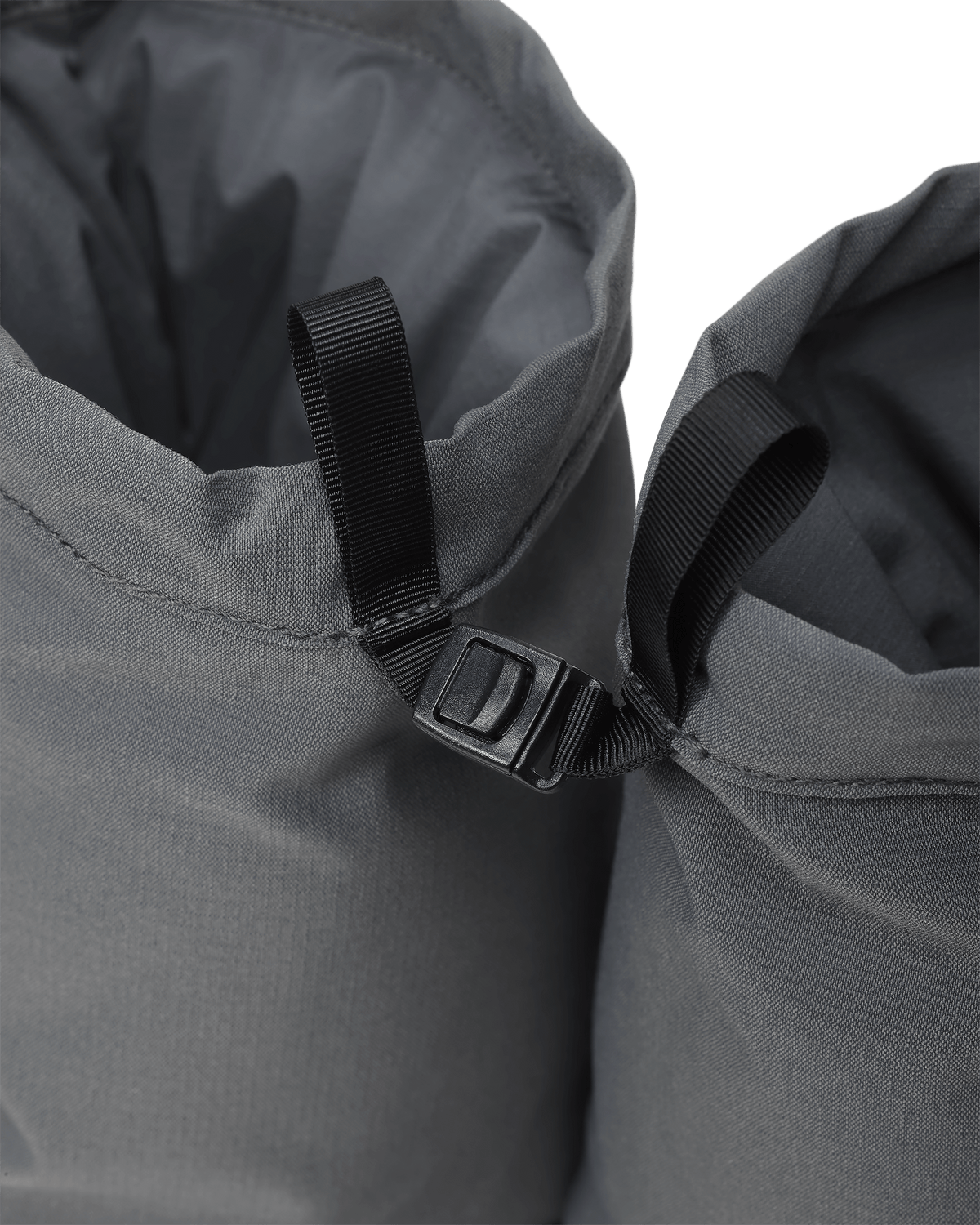 Close-up view of  pull tab and latch sewn at the back of Super Down Burner Bootie in Gunmetal Grey