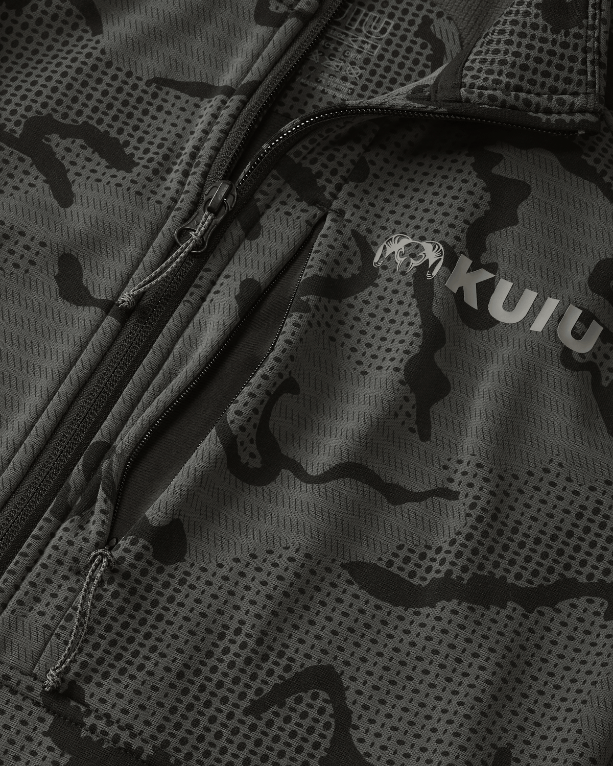Close-up view highlighting front unzipped left chest pocket and half Zip-T feature on Ridgepoint Fleece Zip-T in Black Tonal Pattern