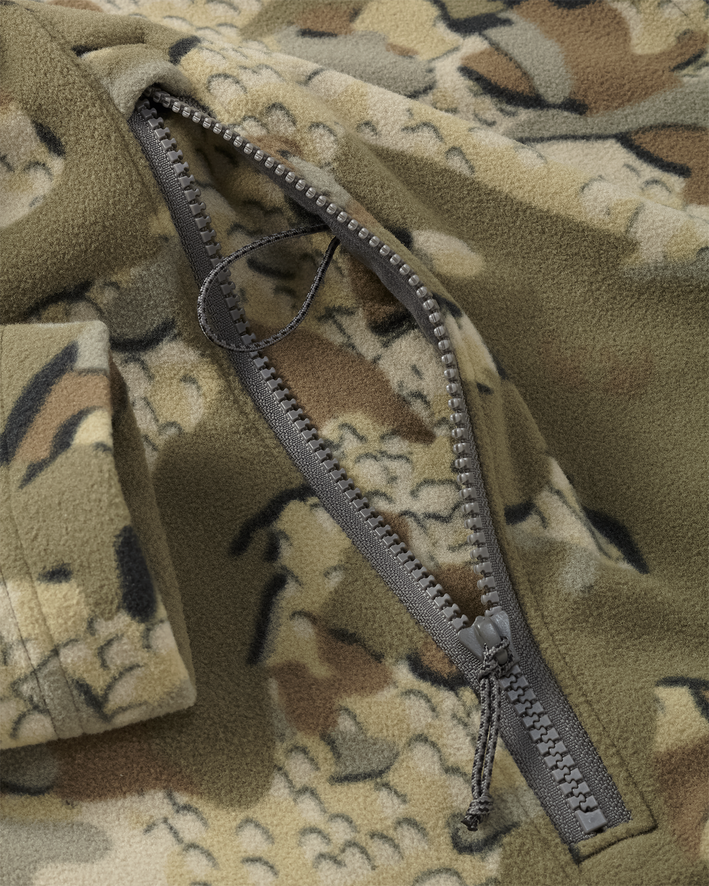 Close-up of zippered pocket with inside  lanyard connection loop on the Border Fleece Full Zip Jacket in Valo Camouflage