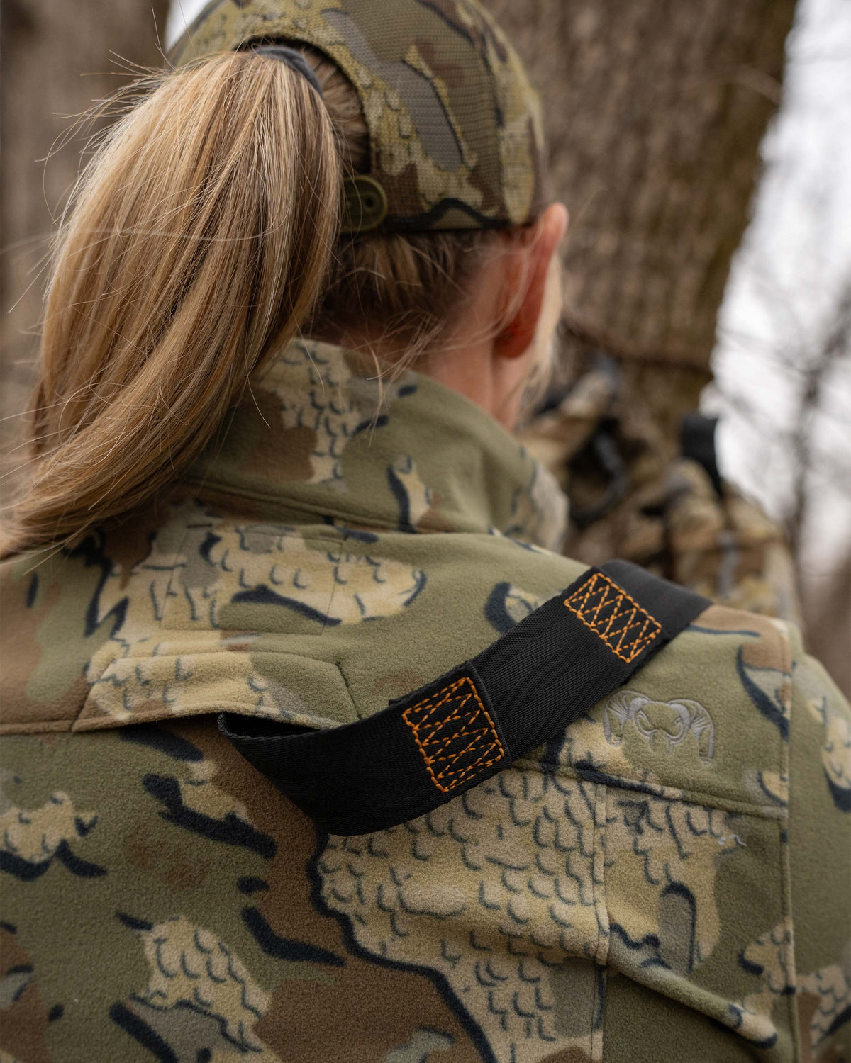 Close-up of back safety harness port on the Women's Border Fleece Full Zip Jacket in Valo Camouflage