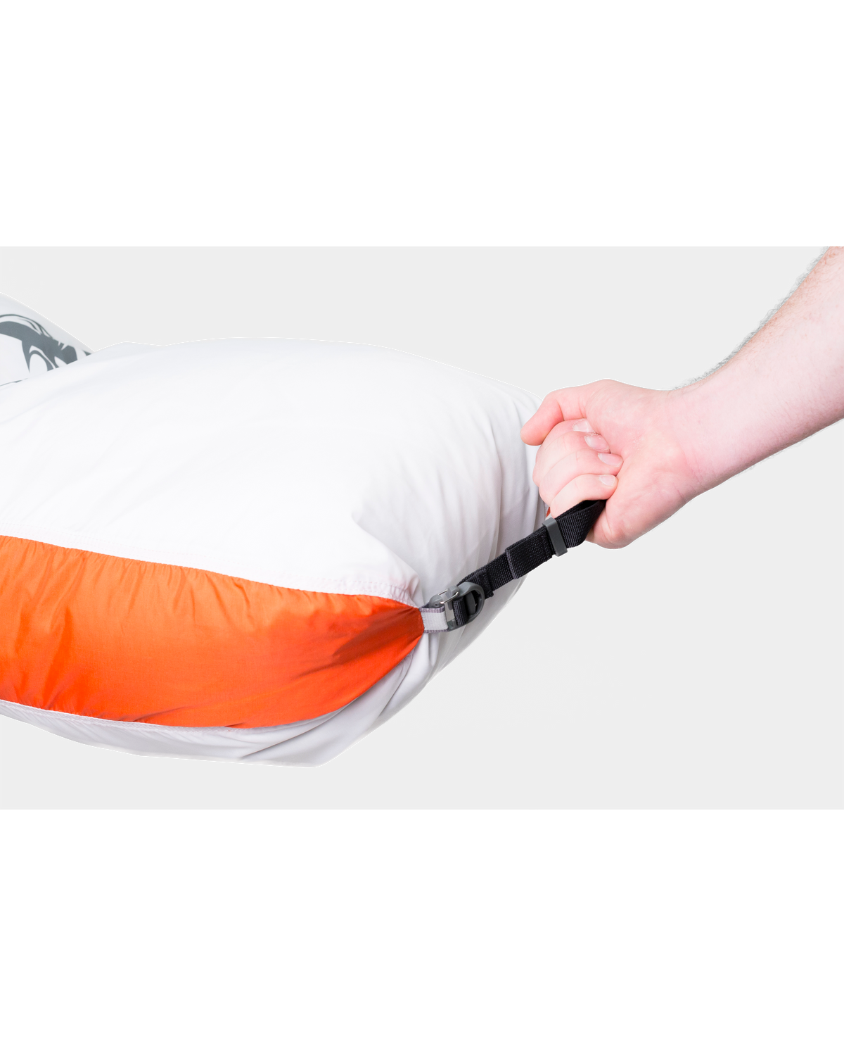 Man grabbing the bag from a clip on the Quarter Game Bag in White / Orange Detail showing the bag clipped from the bottom