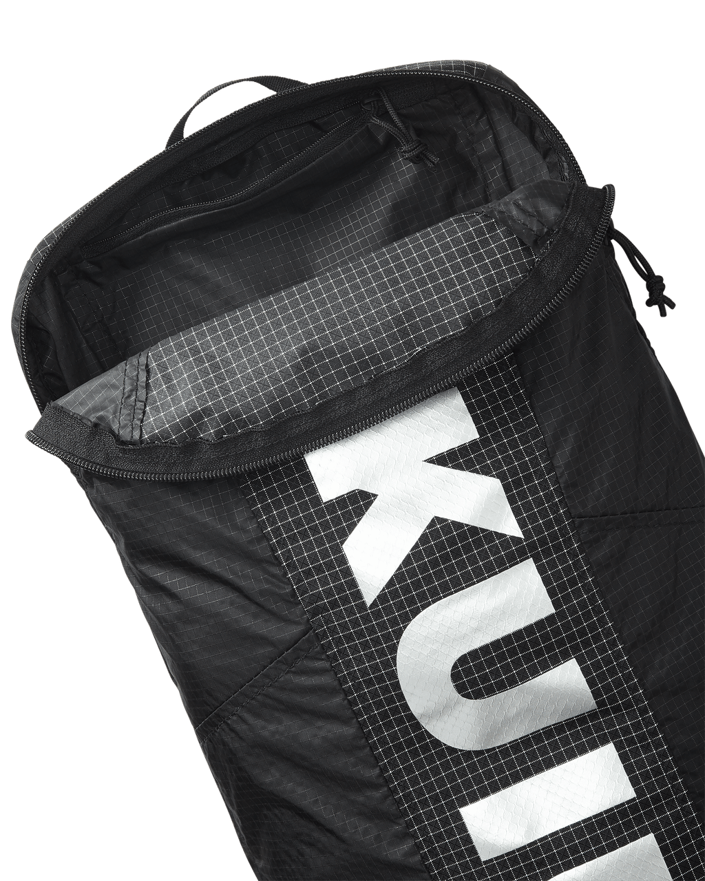Close-up of Extreema Stuffable Pack in Black, Highlighting unzipped inside pocket