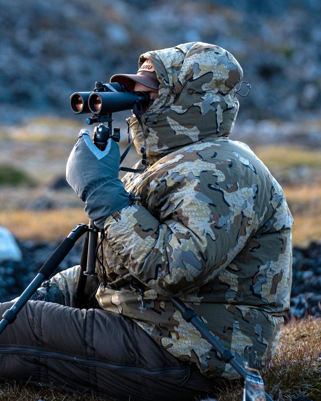 Side of Hunter Glassing Game Wearing Super Down Burner Parka in Valo Camouflage