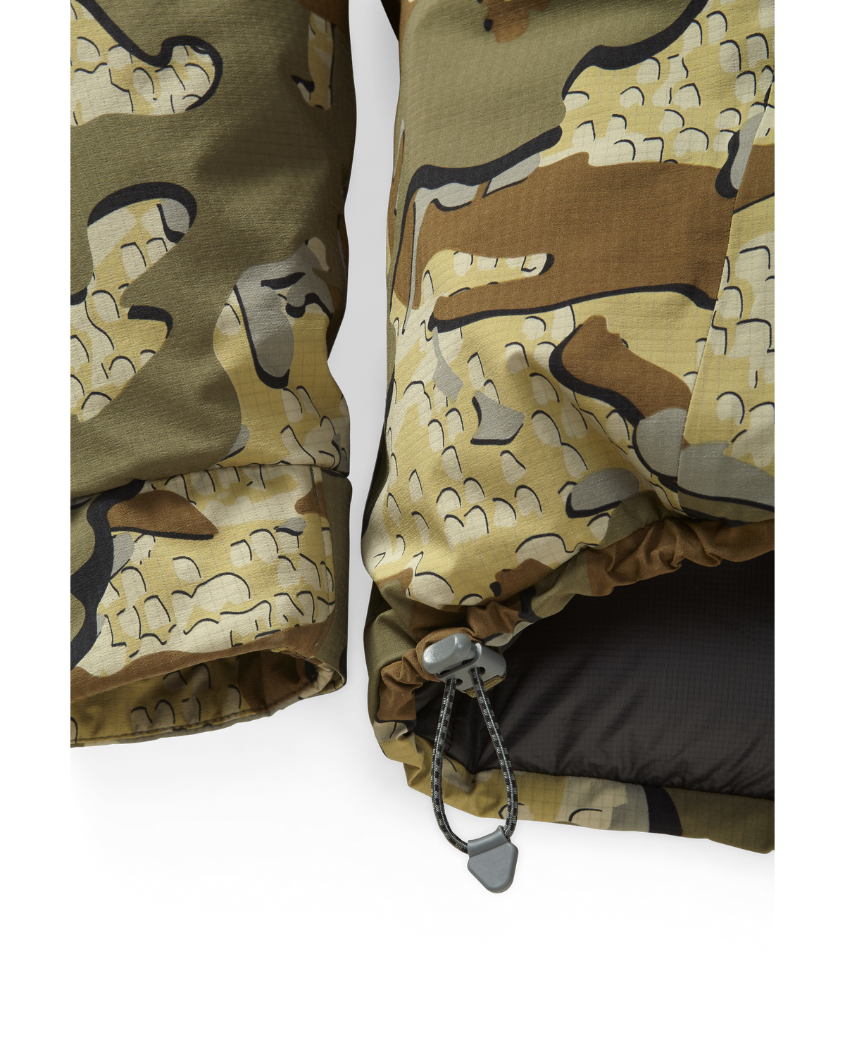 Front, Lower View of Super Down Burner Parka in Valo Camouflage Highlighting Dual Adjust Hem Cinch