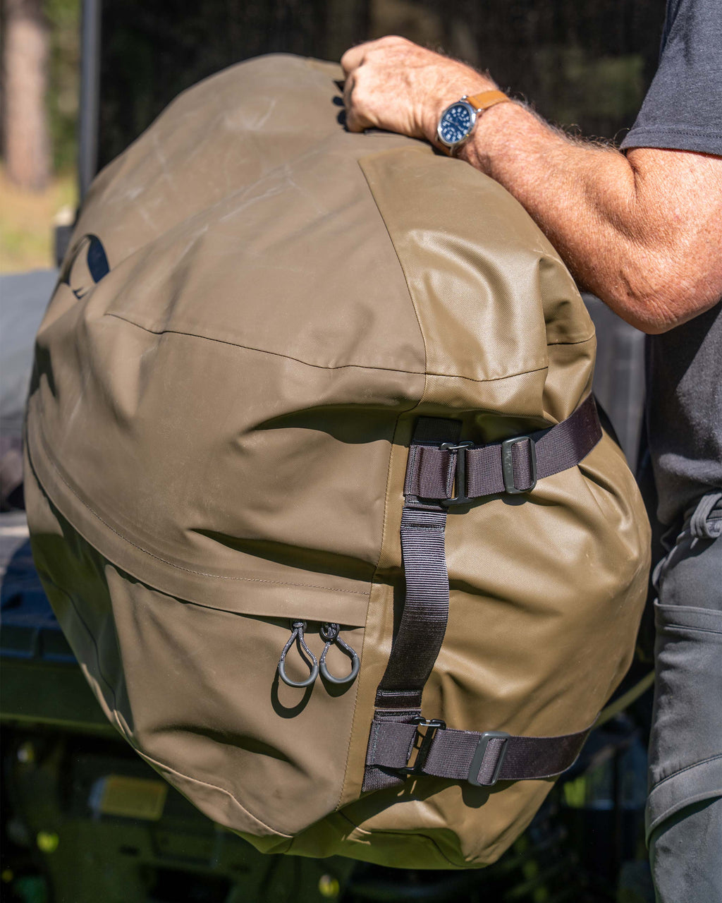 Close-up of Taku BLSTX 10000 Duffel in Bourbon Brown in the rear of a cargo bed