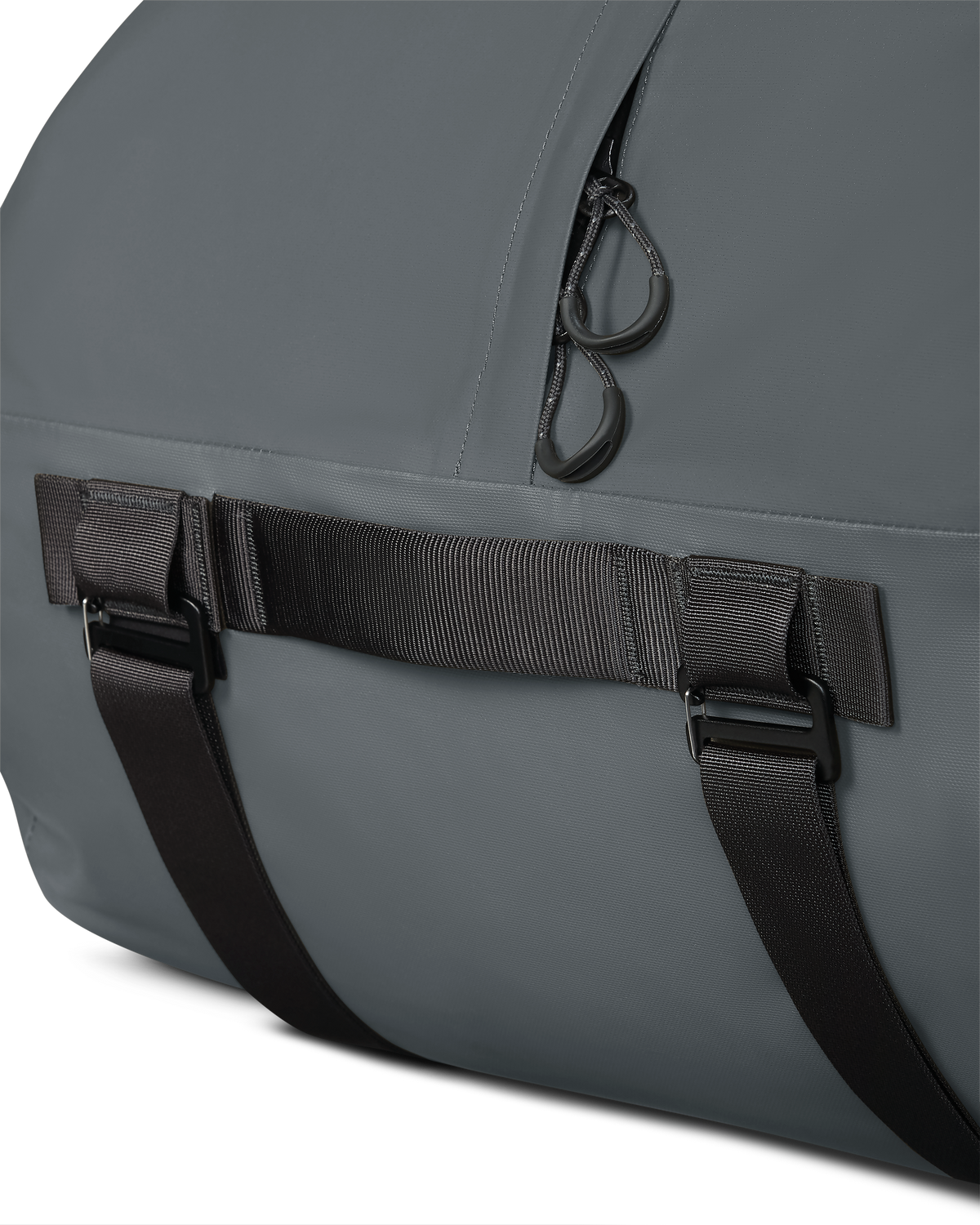 Close-up of top grab handle and corded pull tabs on the Taku BLSTX 4200 Duffel in Gunmetal Grey