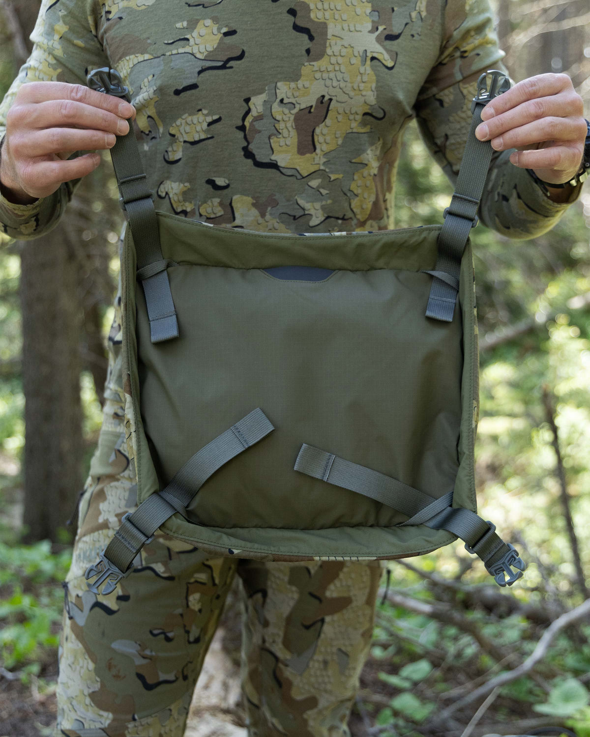 Hunter showing daisy chain adjustable connection points underneath the cover lid on an ICON 6 6000 Pack in Valo Camouflage.
