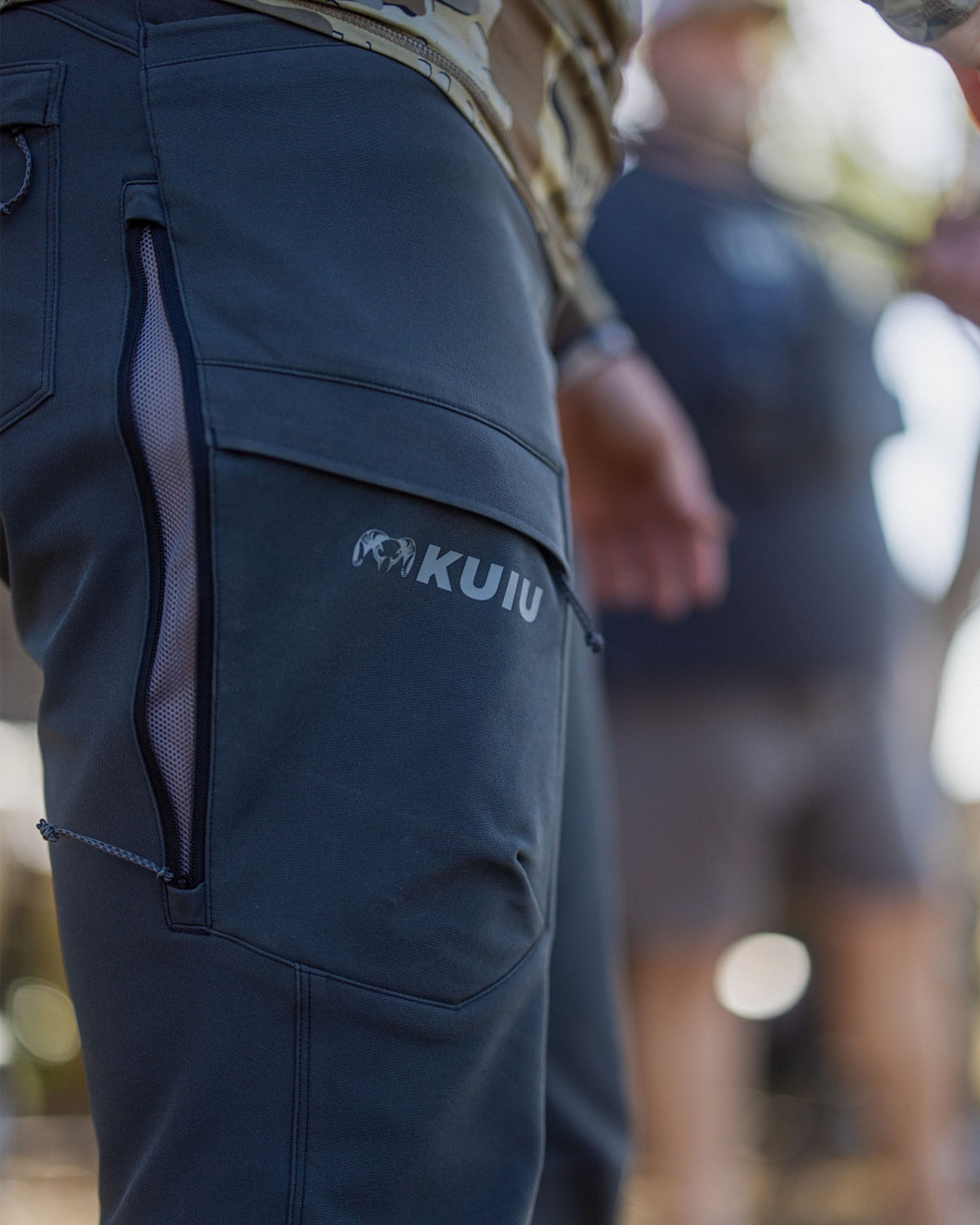Side of Women's Attack Pant in Gunmetal Grey Color Highlighting YKK Zippered, Mesh Backed Hip Vents