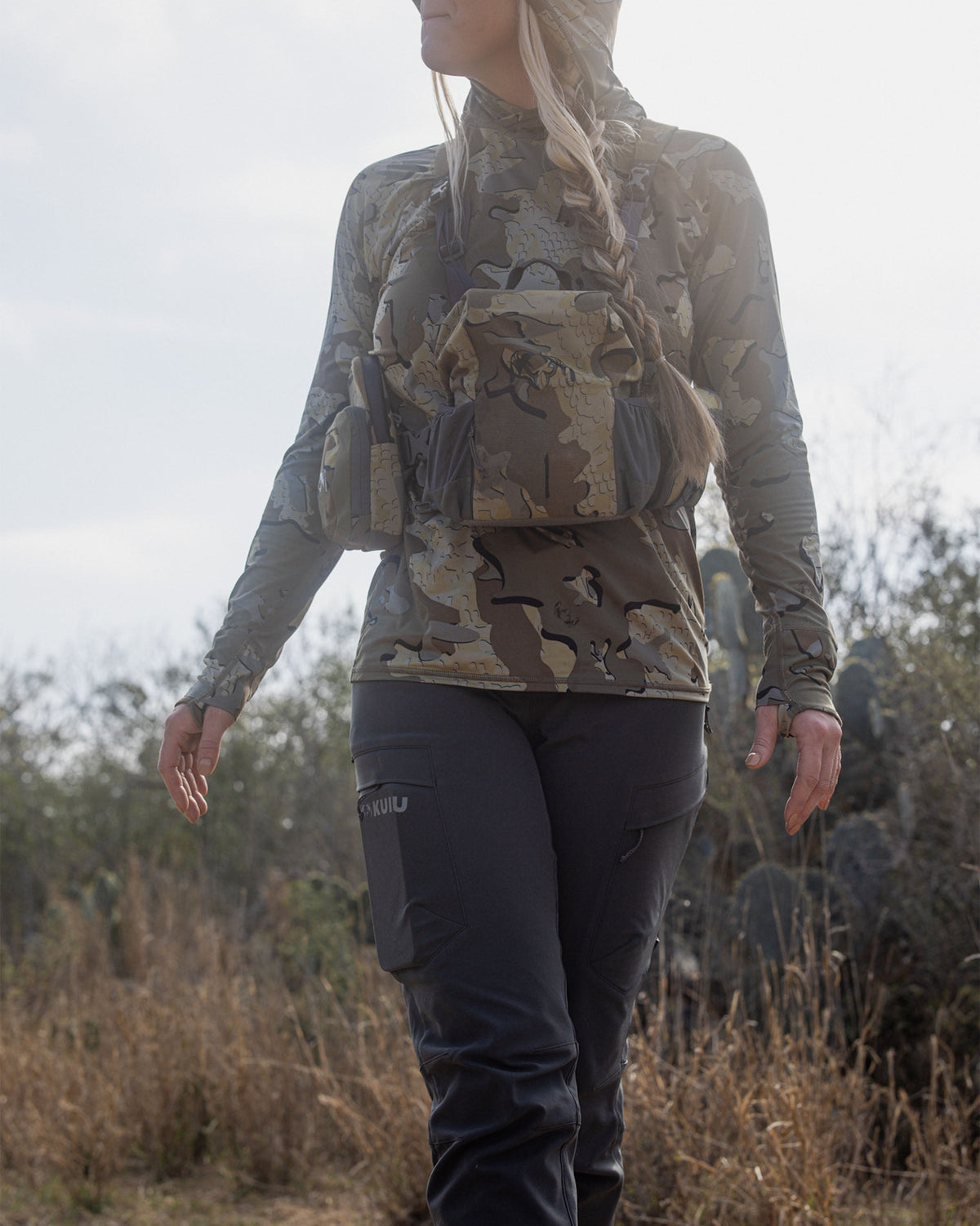 Front of Hunter Wearing Women's Attack Pants in Gunmetal Grey Color Highlighting YKK Zippered Cargo Pockets