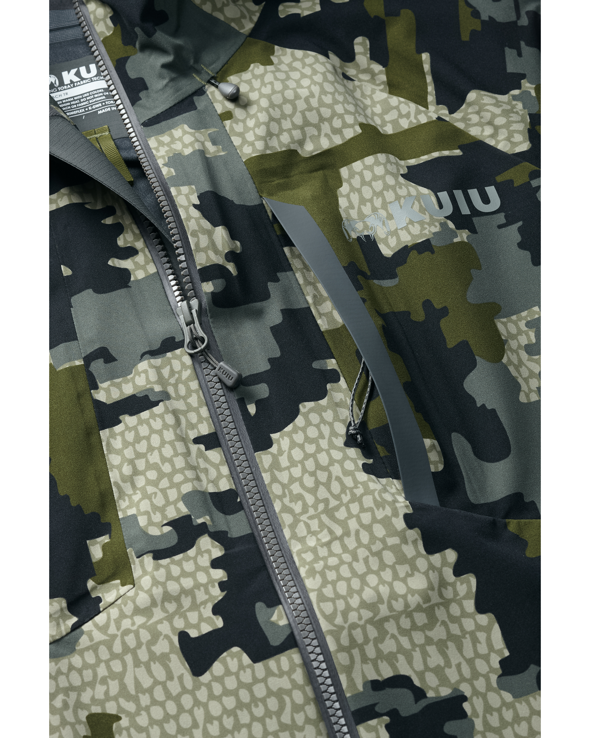 Detail of vertical zippered chest pocket on Women's Chugach TR Rain Jacket in Verde Camouflage