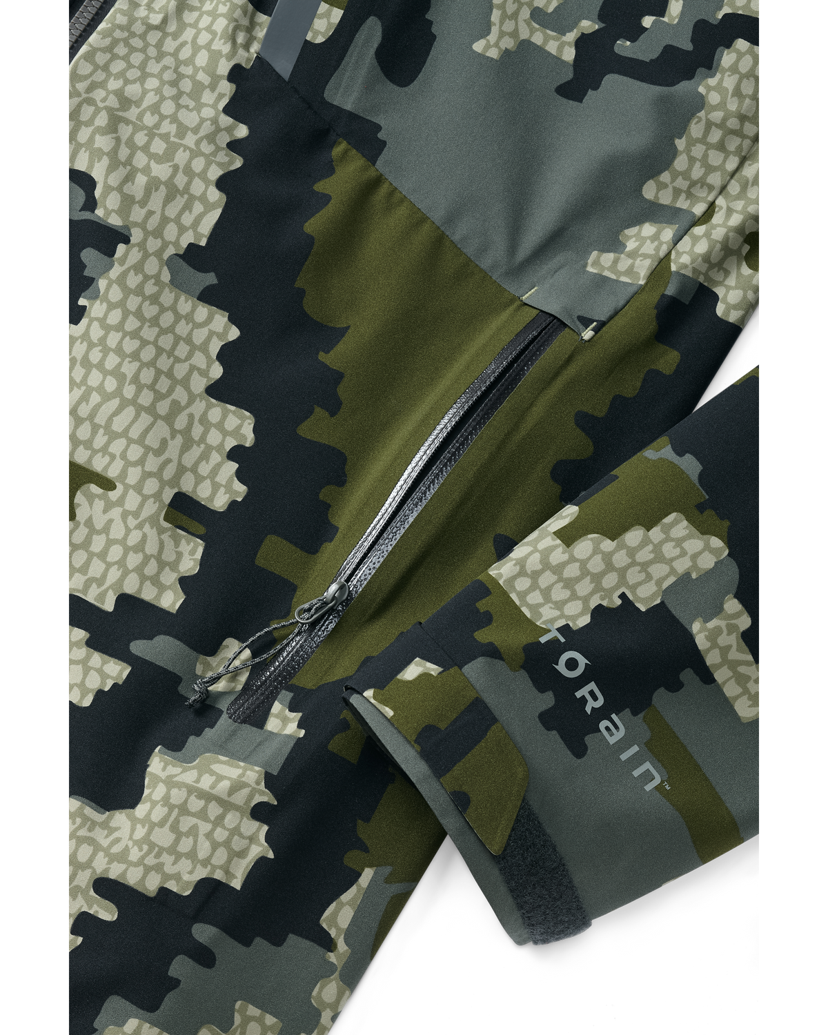 Detail of zippered hand pocket and cuff on Women's Chugach TR Rain Jacket in Verde Camouflage