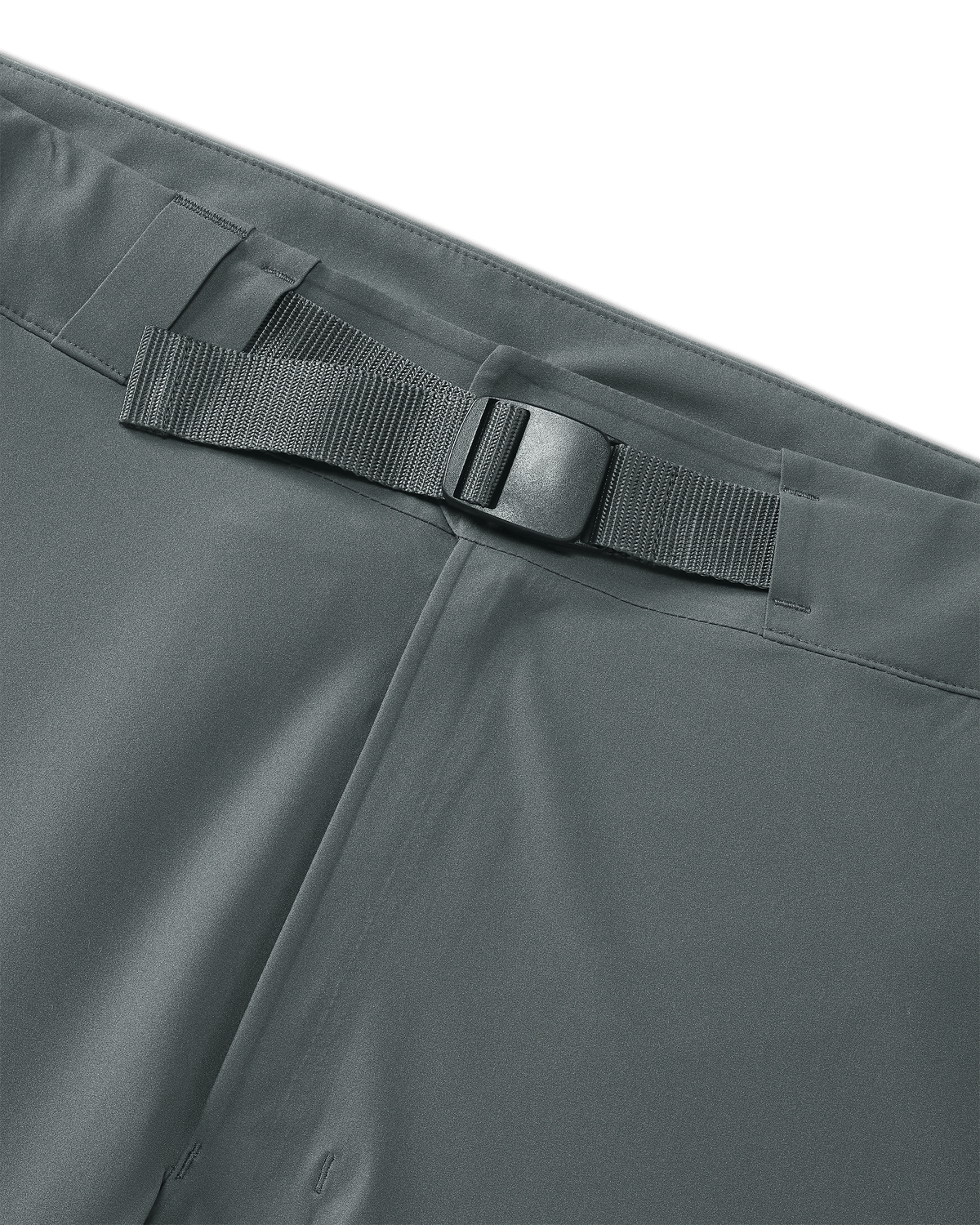Front of Women's Chugach TR Rain Pants in Gunmetal Grey Color Highlighting Adjustable Waist with Built-in Belt