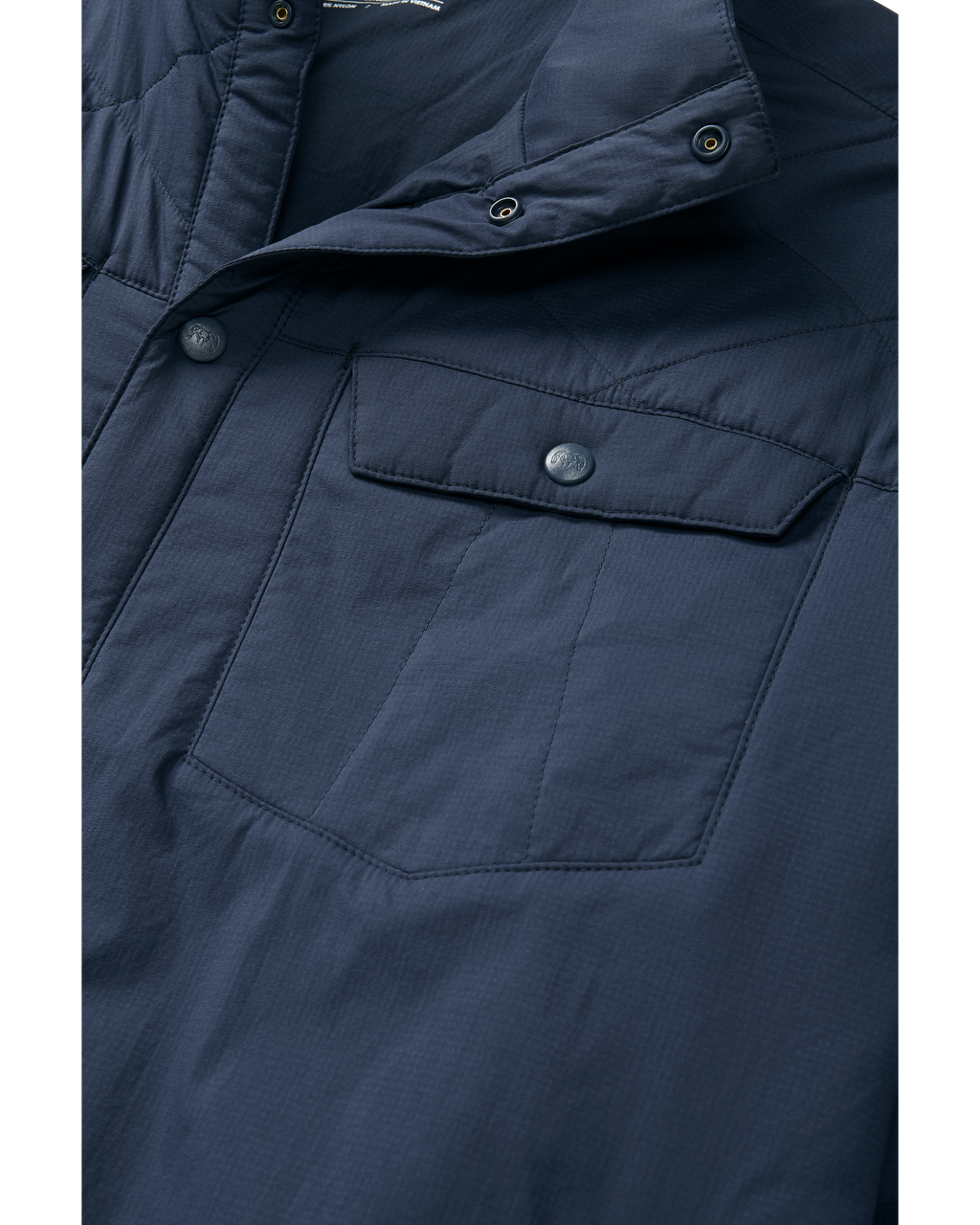 Detail image showing the chest pocket snap on the Base Camp Insulated Snap Shirt in Steel blue