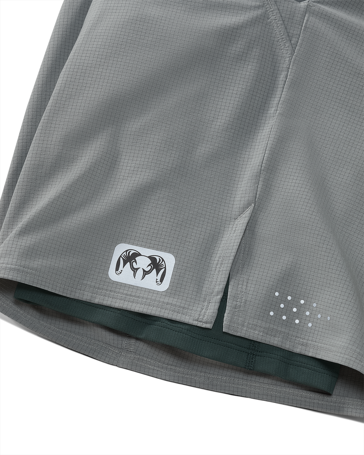 Close-up of reflective logo on bottom hem of EnduroTrainer Lined Short
