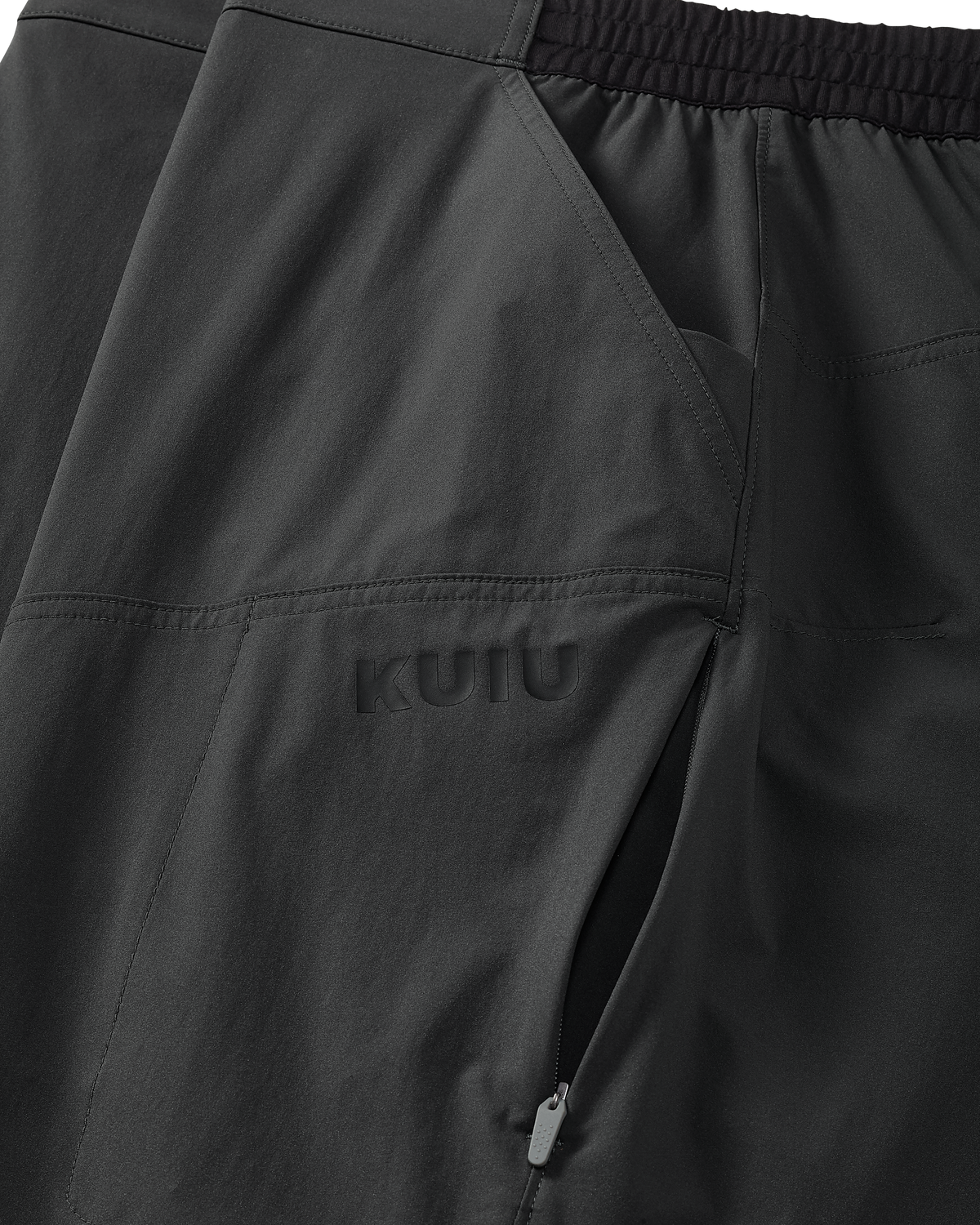 Close-up of open hand pocket and left hip concealer zip pocket on the TrailTrainer Pant in Cast Iron.