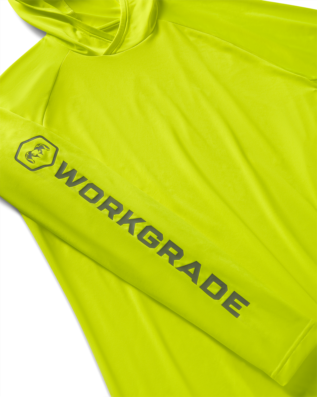 Close-up, flat lay of a Workgrade Long Sleeve Sun Hoodie in neon yellow-green Highlight color laid flat, highlighting the sleeve with a bold “WORKGRADE” logo and hex emblem of a ram printed along the arm.