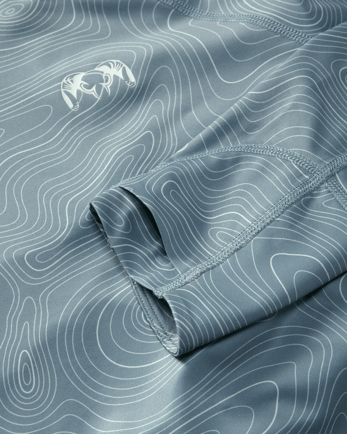 Flat highly breathable fabric and layer thumbhole on Gila LS Hoodie in Glacier Blue Topo Print