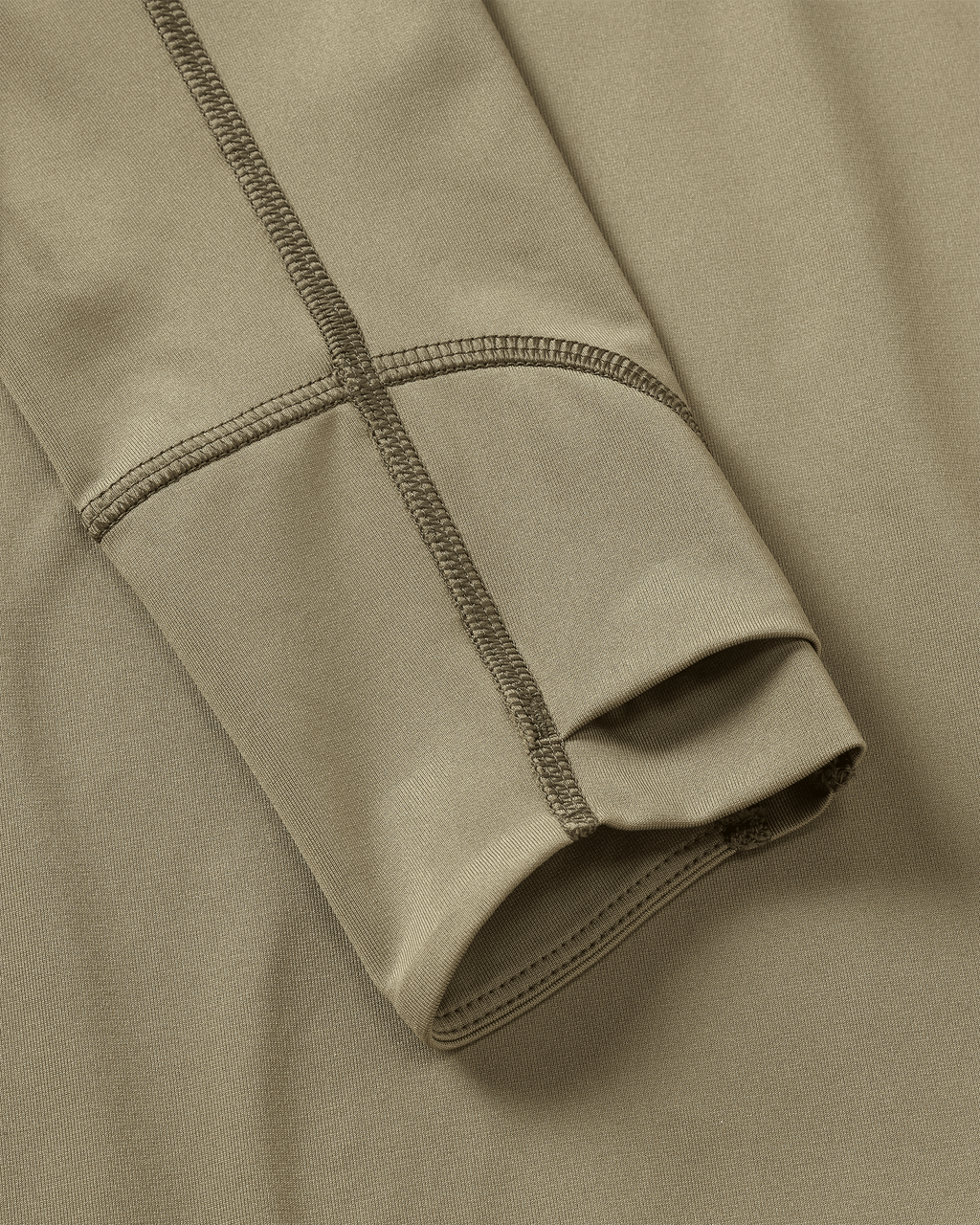 Layered Thumbholes and Flatlock Seams on Youth Gila Long Sleeve Hoodie in Khaki