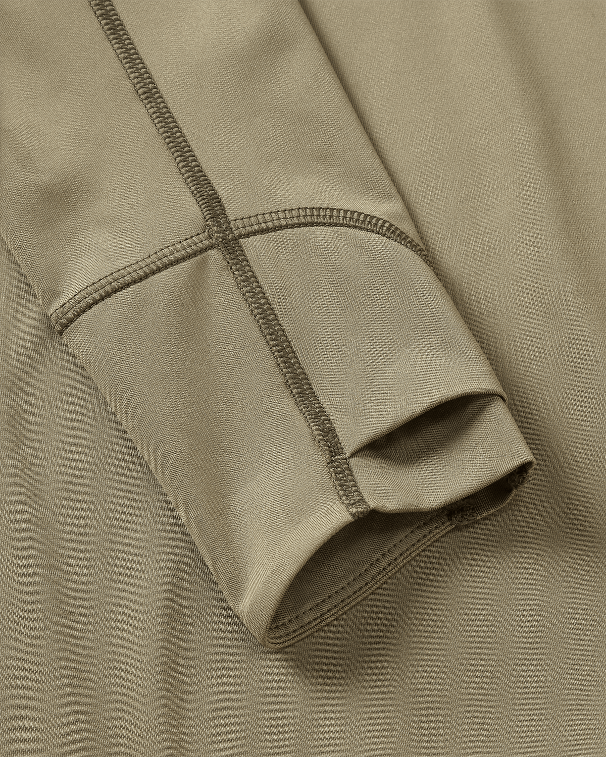 Layered Thumbholes and Flatlock Seams on Youth Gila Long Sleeve Hoodie in Khaki