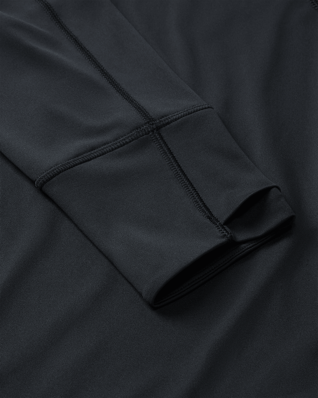 Layered Thumbholes and Flatlock Seams on Gila Long Sleeve Hoodie in Black