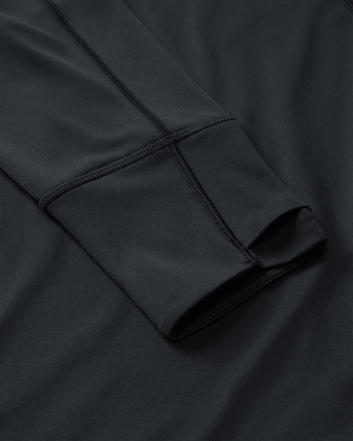 Layered Thumbholes and Flatlock Seams on Gila Long Sleeve Hoodie in Black