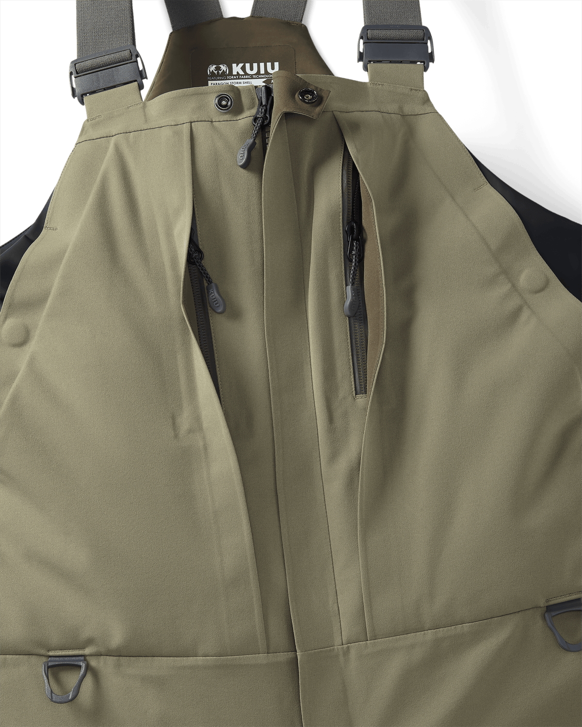 Close-up of front vertical zippered chest pockets on the Paragon Storm Shell Bib in Arctic Shadow Khaki