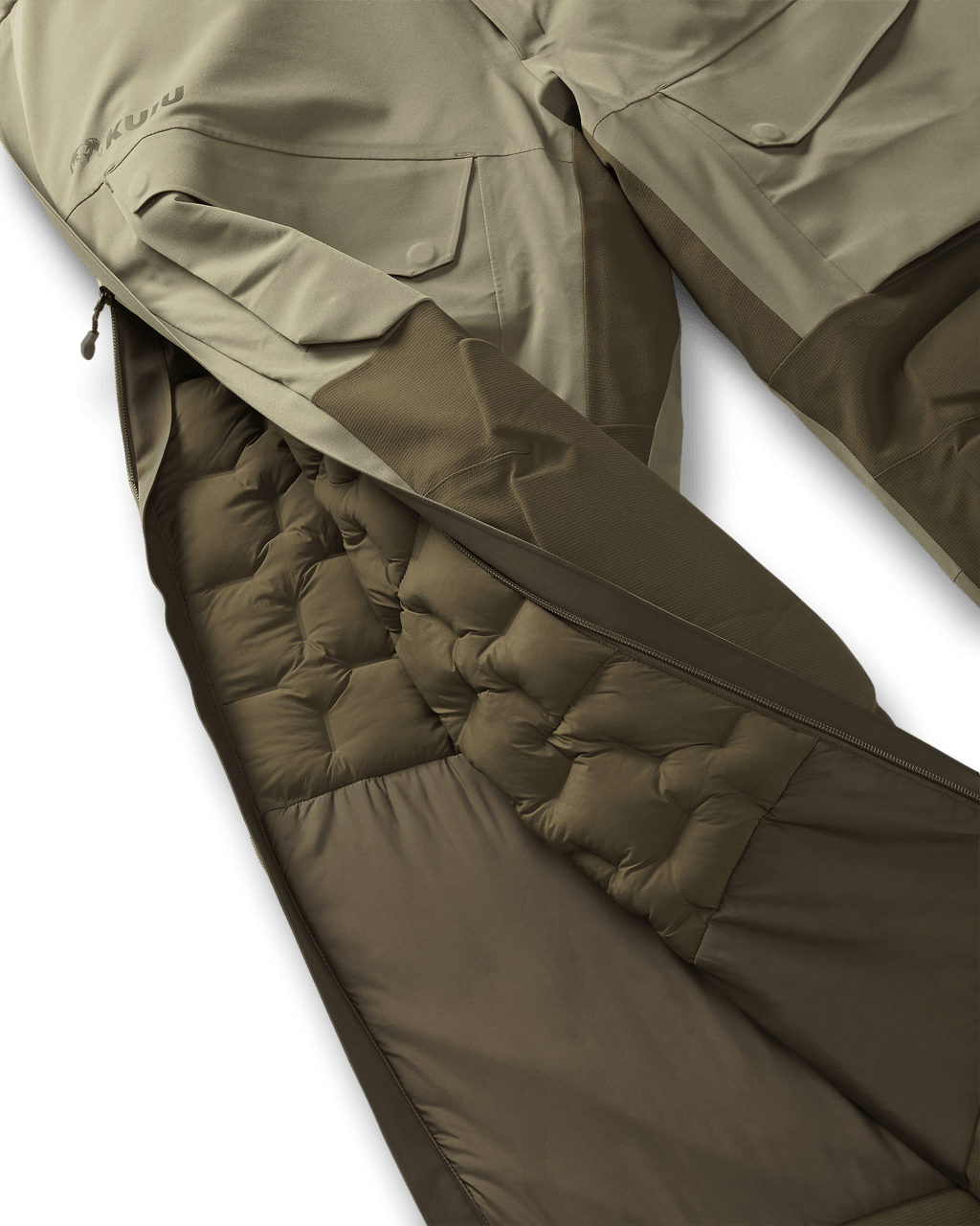Unzipped right side leg zipper, highlighting interior insulation stitched baffles on the Paragon Storm Shell Bib in Arctic Shadow Khaki