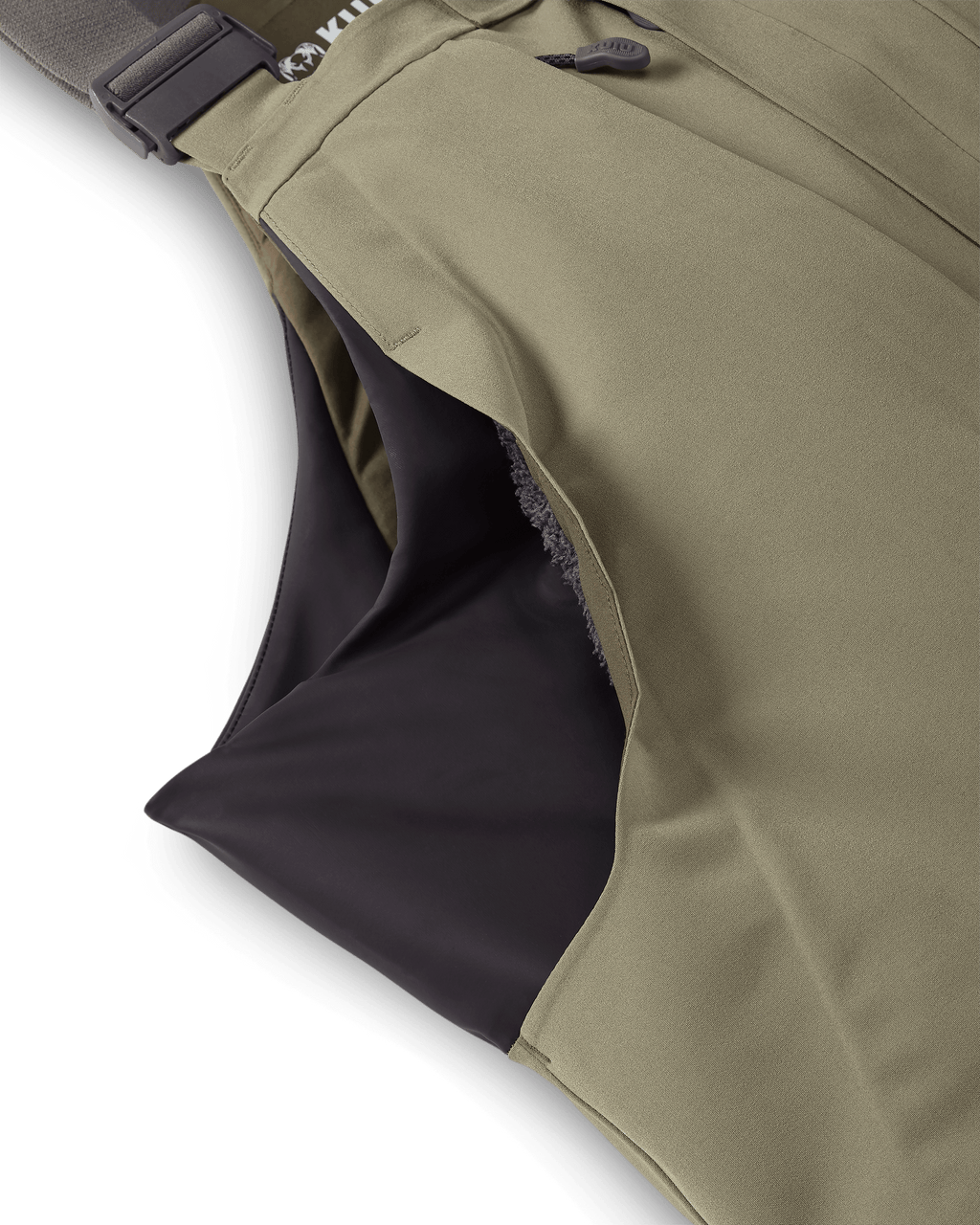 Stretch side paneling and Sherpa fleece-lined hand pockets on the KUIU Paragon Storm Shell Bib for waterfowl hunting