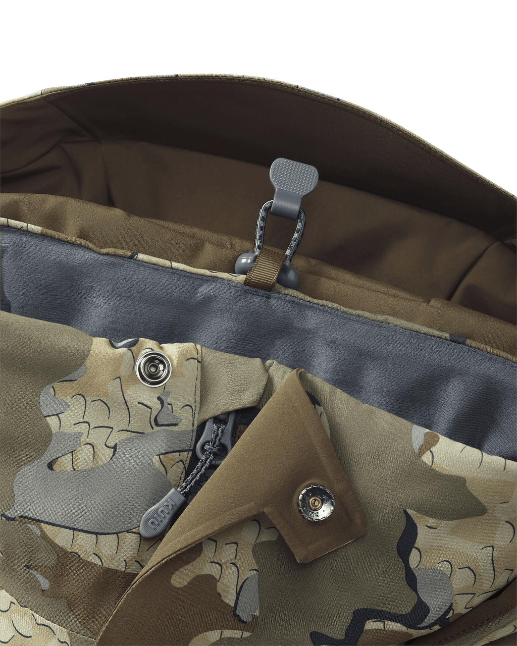 Stowed drop-away hood keeper on the KUIU Paragon Storm Shell Parka in Valo Camouflage