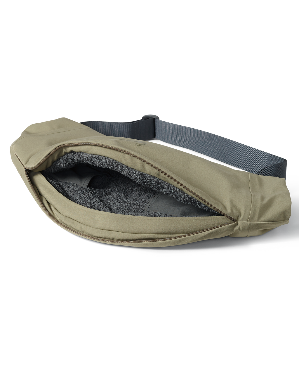 Unzipped full-length zipper revealing the sherpa fleece interior of the Paragon Storm Shell Hand Muff in Arctic Shadow Khaki