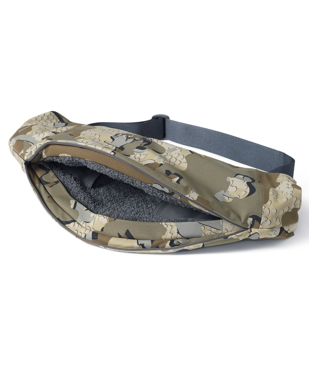 Unzipped full-length zipper revealing the sherpa fleece interior of the Paragon Storm Shell Hand Muff in Valo Camouflage