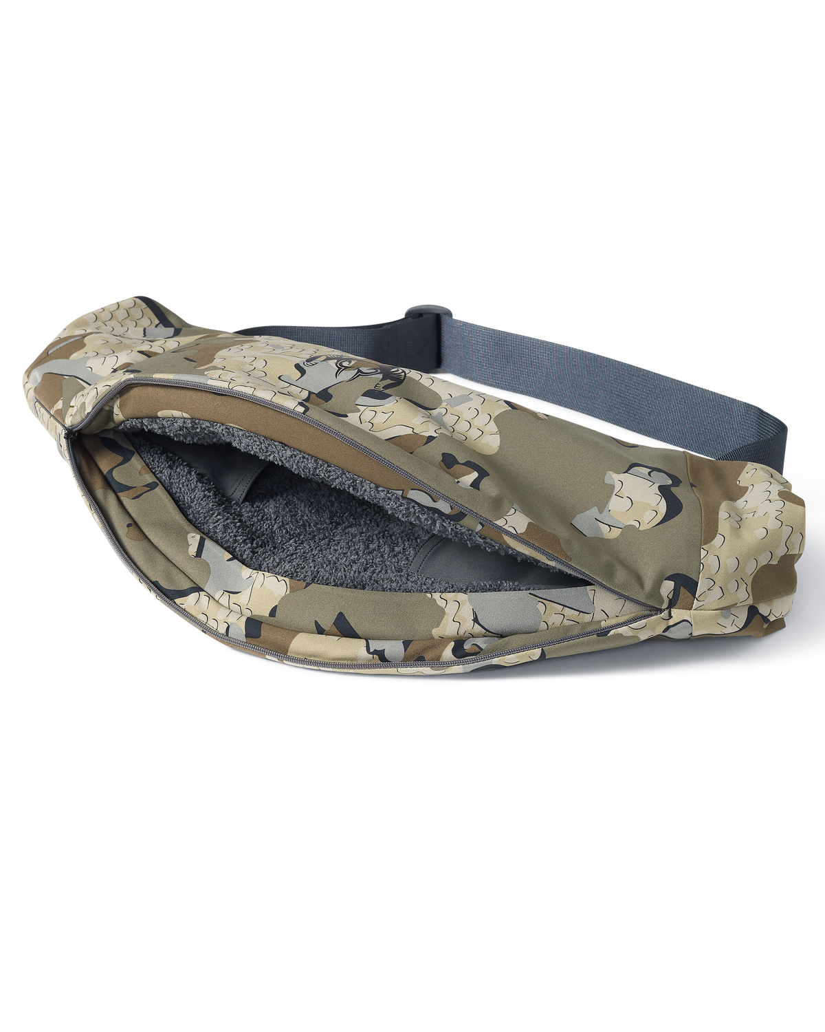 Unzipped full-length zipper revealing the sherpa fleece interior of the Paragon Storm Shell Hand Muff in Valo Camouflage