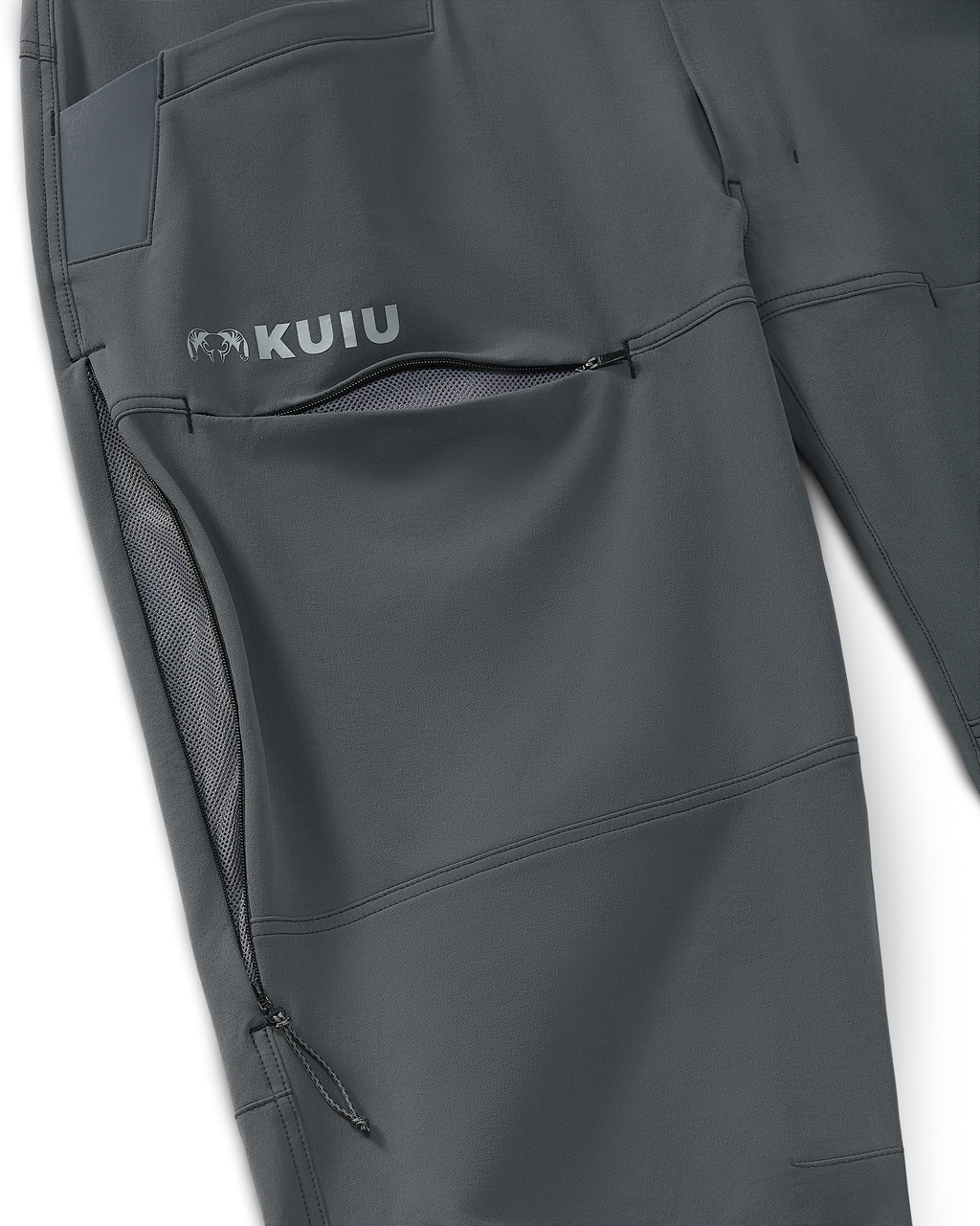 Close-up of front hidden zipper thigh pocket and side zippered mesh hip vent on Reed Pant in Gunmetal Grey