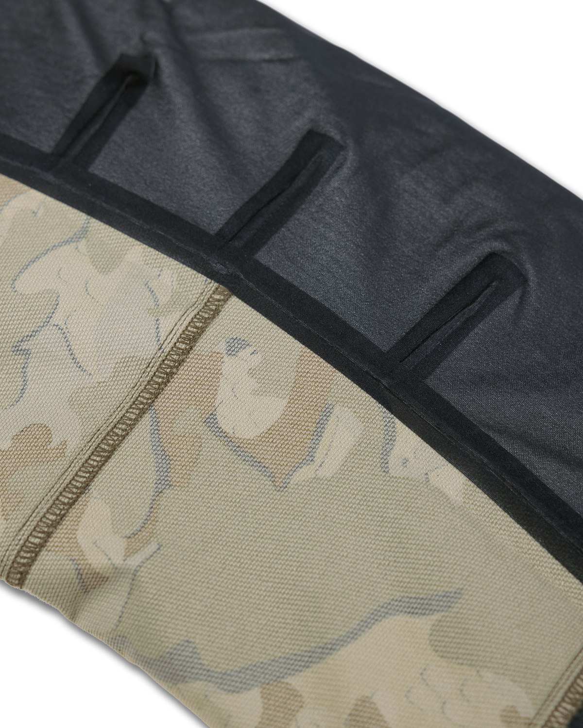 Detail lower leg inside seam tape on the Kutana Hybrid Pant in Valo Camouflage